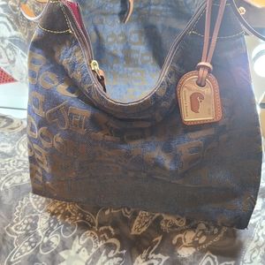 Denim and leather handbag by Dooney and Bourke.